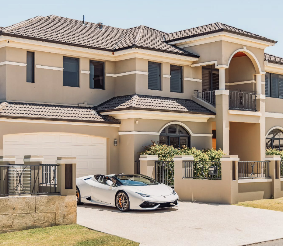 White Lamborghini Huracán Spyder in the driveway of a Mirage Stays residence