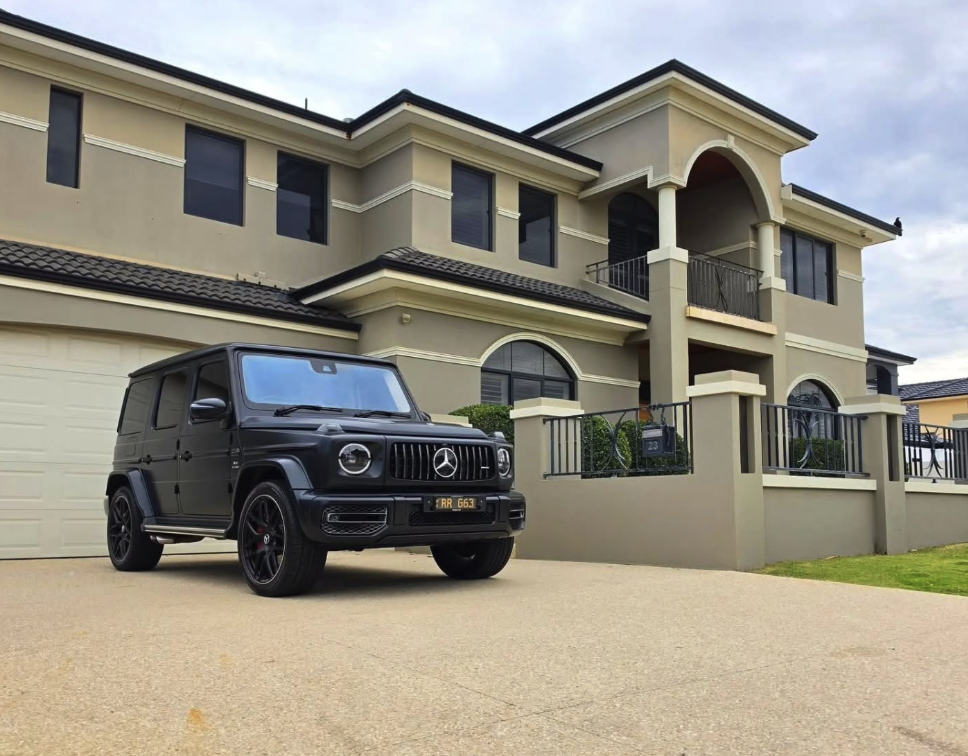 Matte black Mercedes-AMG G 63 in the driveway of a Mirage Stays residence